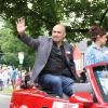 "Jesse" James Leija waves to fans along the parade route