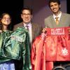 Gabriela & Sebastian Fundora present Hall director Ed Brophy with fight worn robe & trunks.